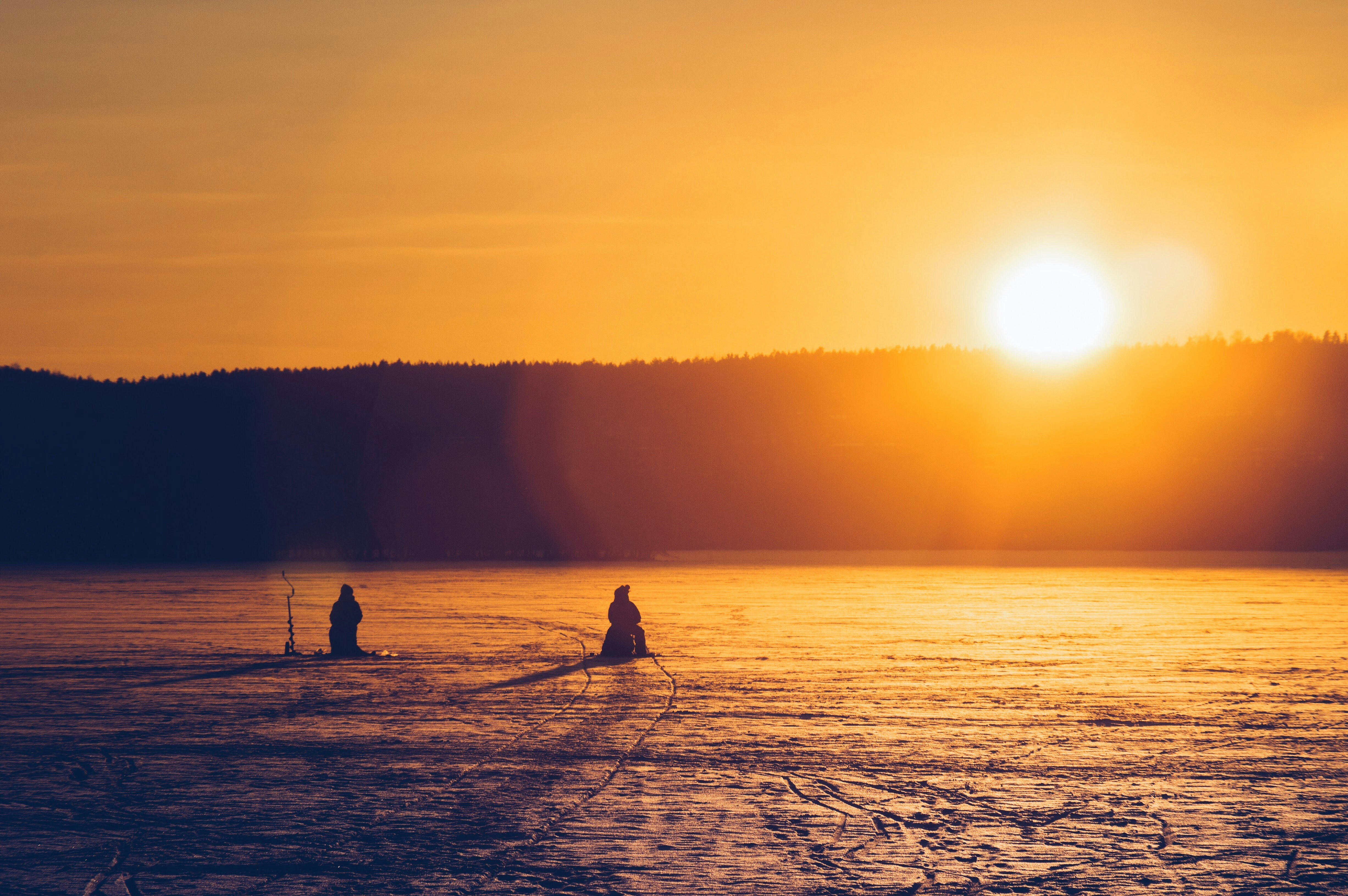 Ice fishing on a winter lake